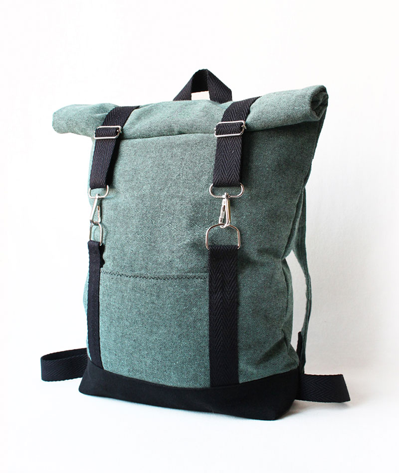 Roll top turquoise black backpack