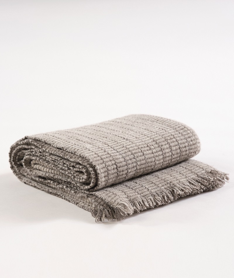 Organic wool blanket made by Teixidors in collaboration with John Pawson stone