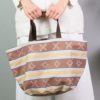 Reversible carrycot bag made with an old brown mattress fabric